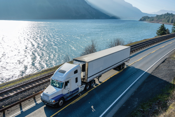Transport Truck Driving along Mountain Side