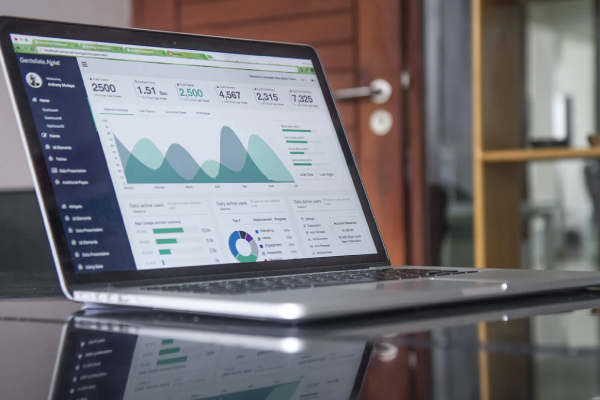 recruitment dashboard with graphs displayed on a laptop screen