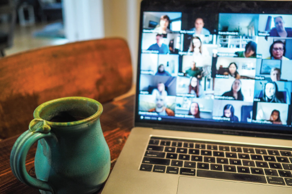 laptop screen showing virtual zoom meeting in progress 