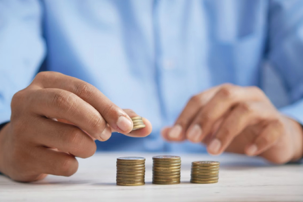 Man Stacking Coins