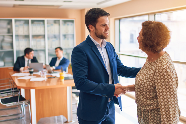 man shaking customer hand